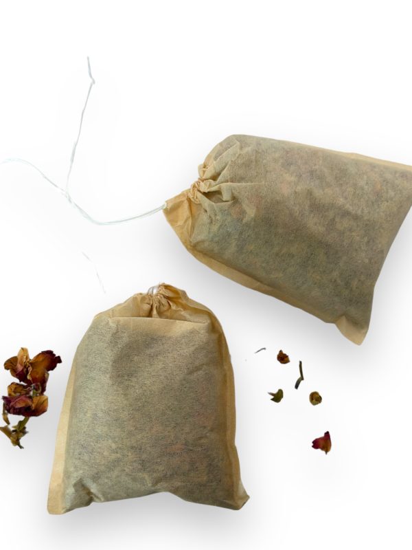 Two bath tea bags with loose flower petals